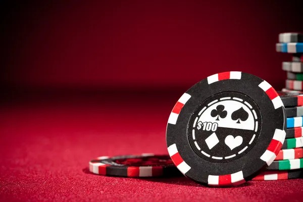 Close-up of a live roulette wheel and betting table with dealer and player interaction